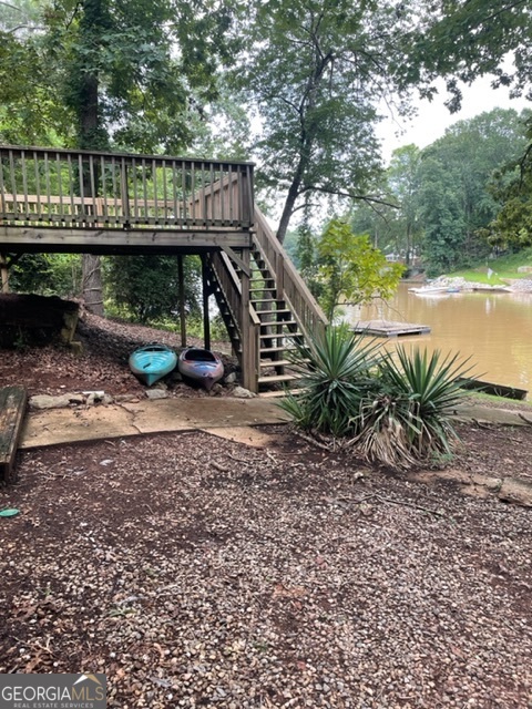 132 Collins Road Jackson, GA 30233 - Photo 38 of 39 a view of a roof deck with wooden floor and fence