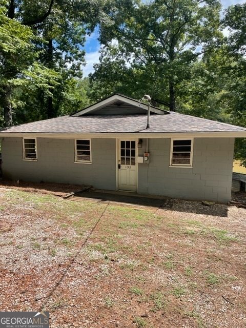 132 Collins Road Jackson, GA 30233 - Photo 4 of 39 a house with trees in the background