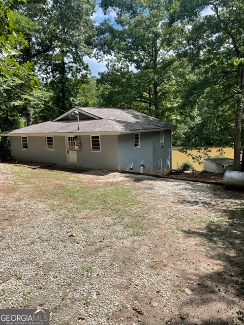 132 Collins Road Jackson, GA 30233 - Photo 5 of 39 a front view of a house with a garden