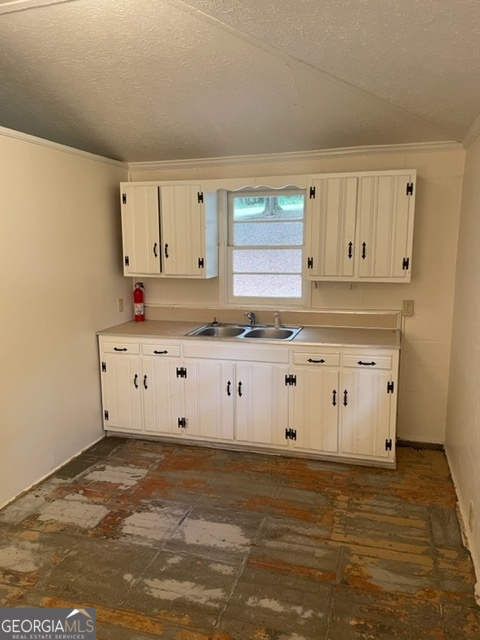 132 Collins Road Jackson, GA 30233 - Photo 7 of 39 a view of kitchen with wooden cabinets