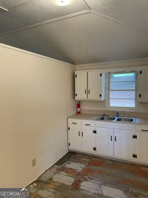 132 Collins Road Jackson, GA 30233 - Photo 8 of 39 a kitchen with granite countertop a sink and a stove