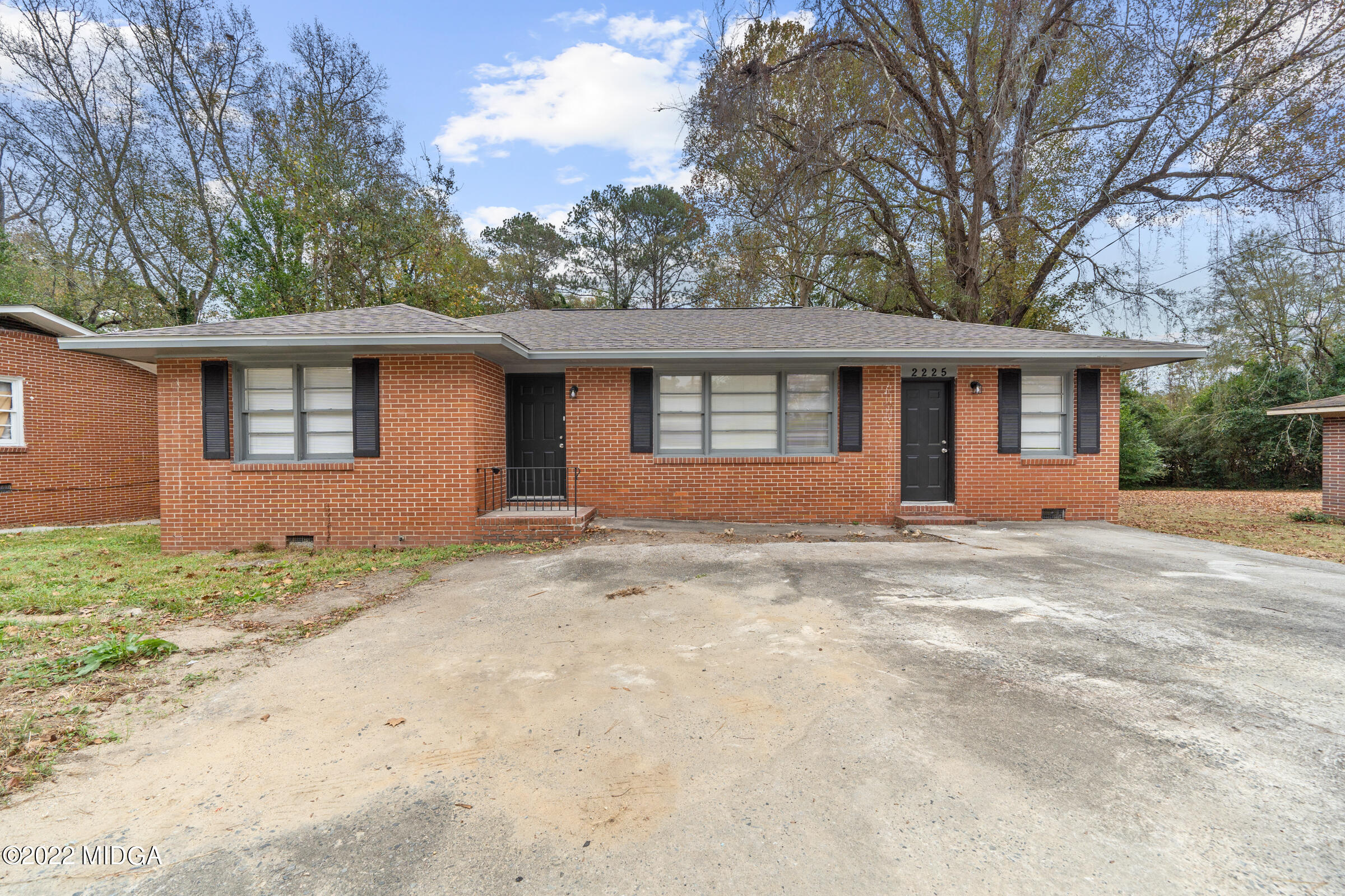 2225 Millerfield Road Macon, GA 31217 - Photo 1 of 21 a front view of a house with a garden