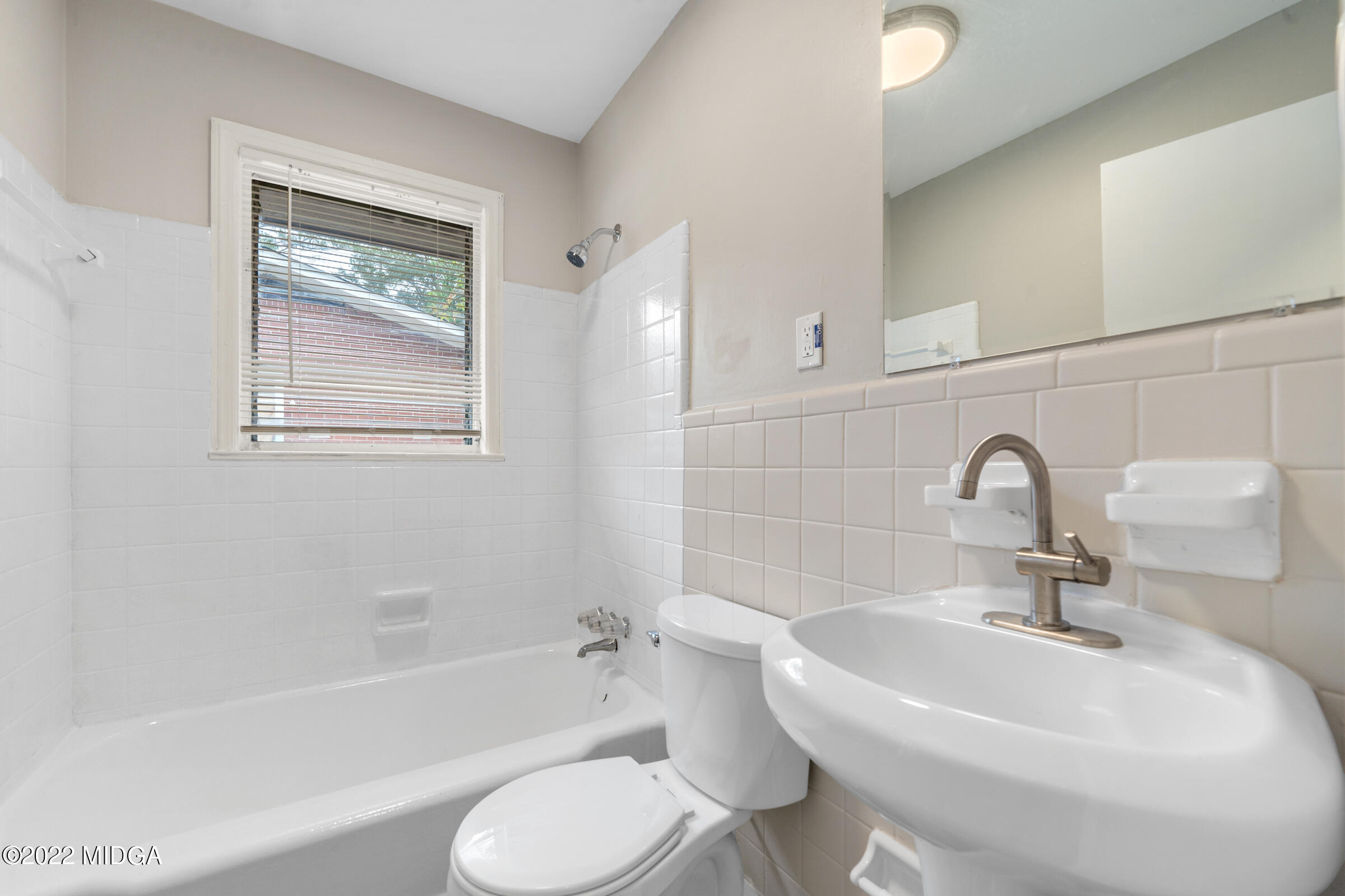 2225 Millerfield Road Macon, GA 31217 - Photo 17 of 21 a bathroom with a sink toilet and bathtub