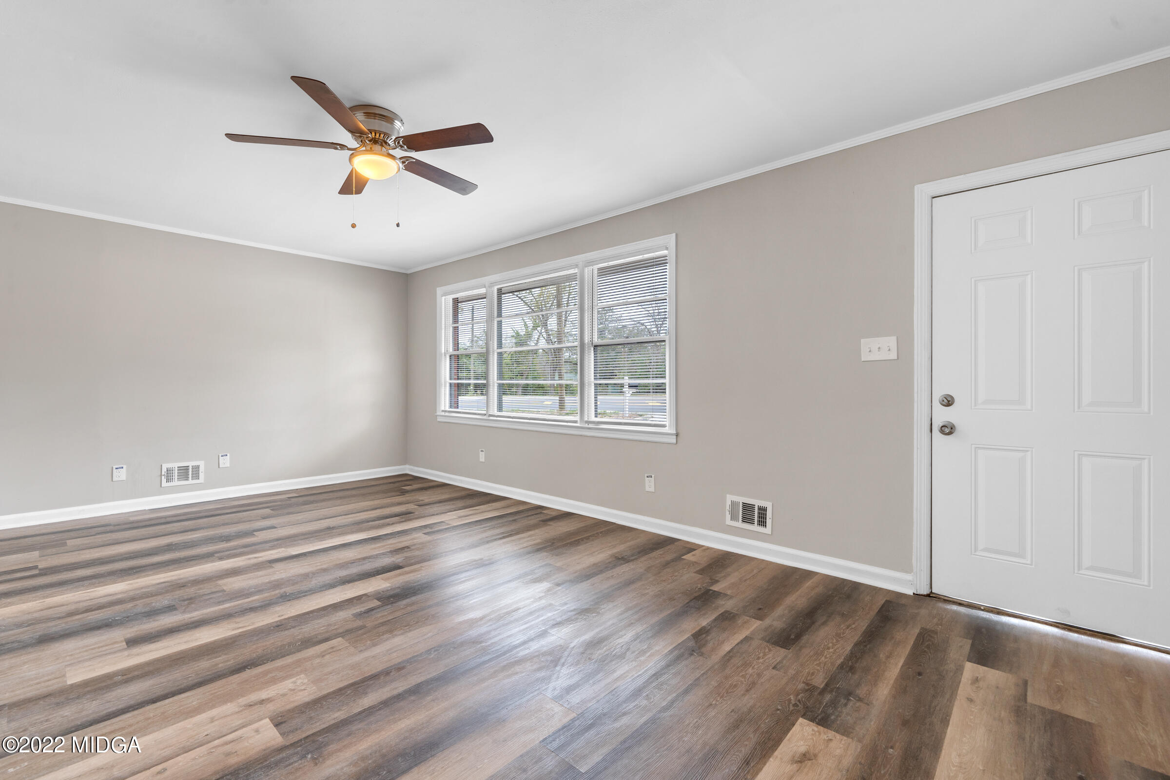 2225 Millerfield Road Macon, GA 31217 - Photo 4 of 21 wooden floor in an empty room with a window