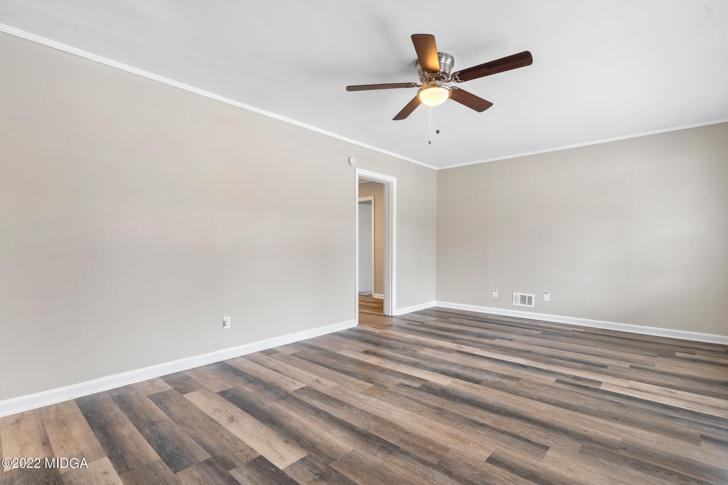2225 Millerfield Road Macon, GA 31217 - Photo 5 of 21 an empty room with ceiling fan and window