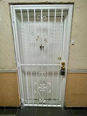 a view of a door with wooden door