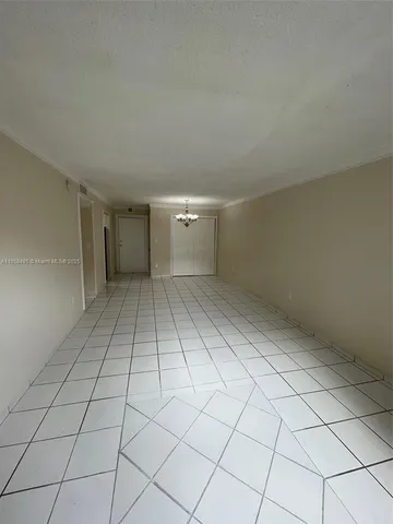 a view of an empty room and entryway