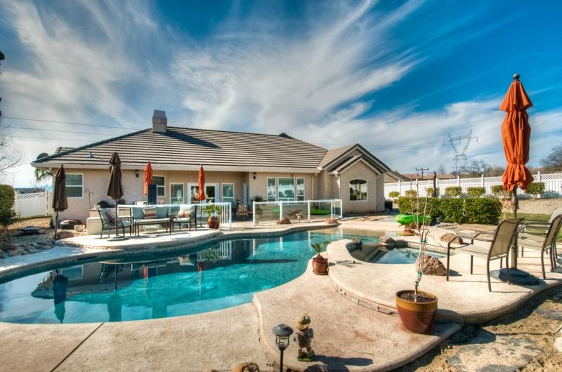 973 River Bend Road Redding, CA 96003 - Photo 28 of 34 Back view of the home with pool and spa