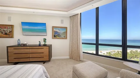 a bathroom with a granite countertop sink a toilet and a mirror