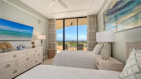 a view of a balcony with an outdoor seating