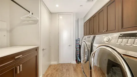 a view of a patio with table and chairs potted plants