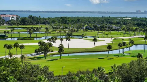 a view of a dining room with furniture and a chandelier