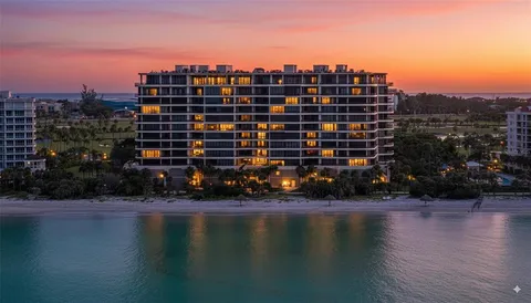 a view of a swimming pool with a yard