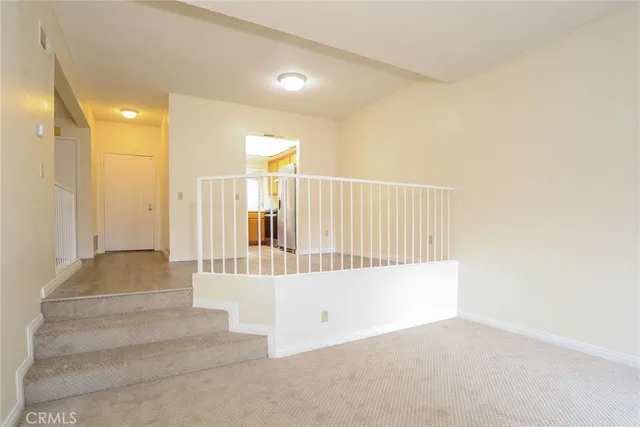 a view of staircase with white walls
