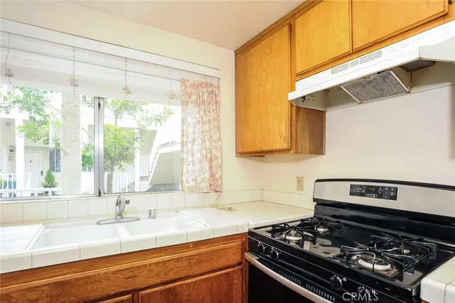 a kitchen with a stove and a sink