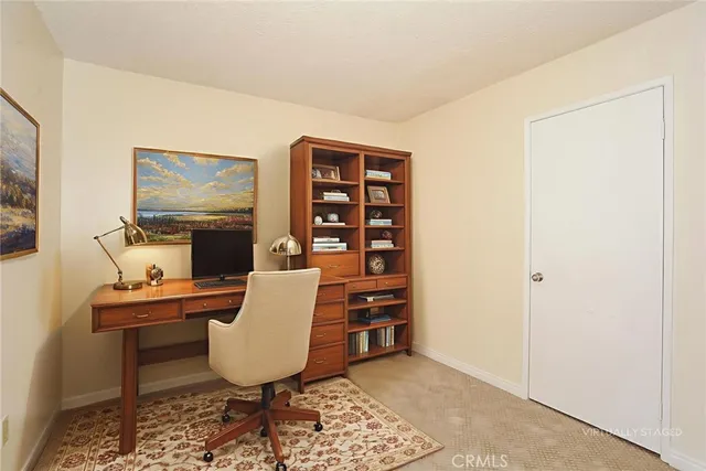 a view of a workspace with furniture