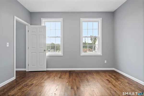 a view of a hallway with windows