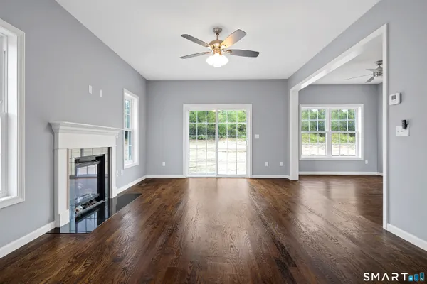 a view of a hallway with wooden floor