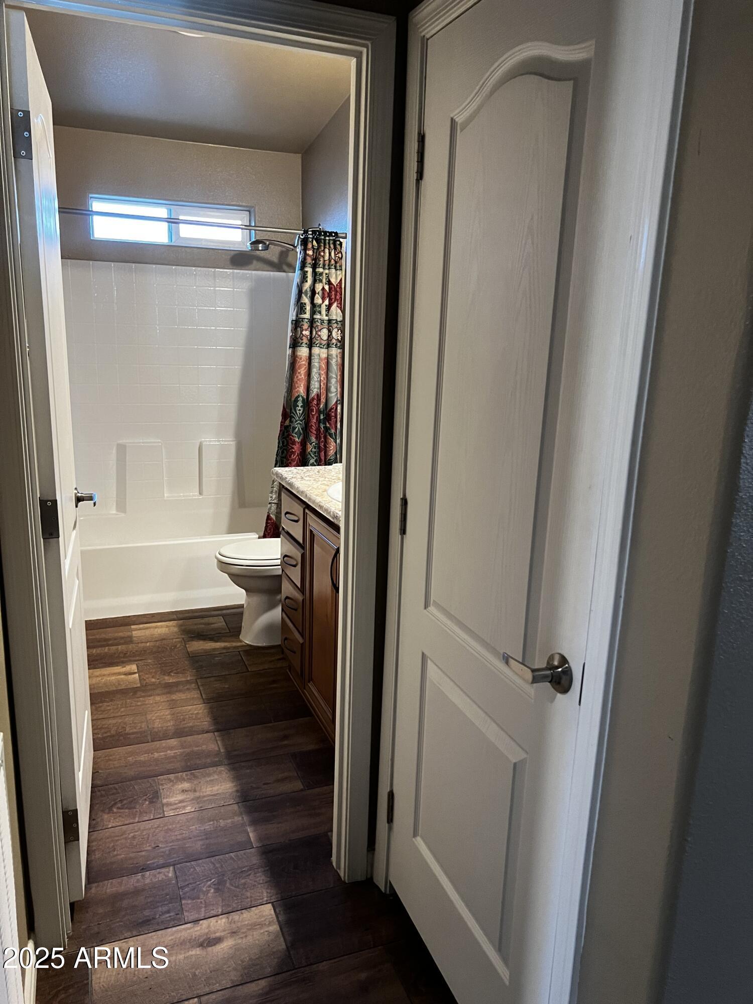 8865 East Baseline Road, Unit 555 Mesa, AZ 85209 - Photo 14 of 21 a bathroom with a tub and mirror