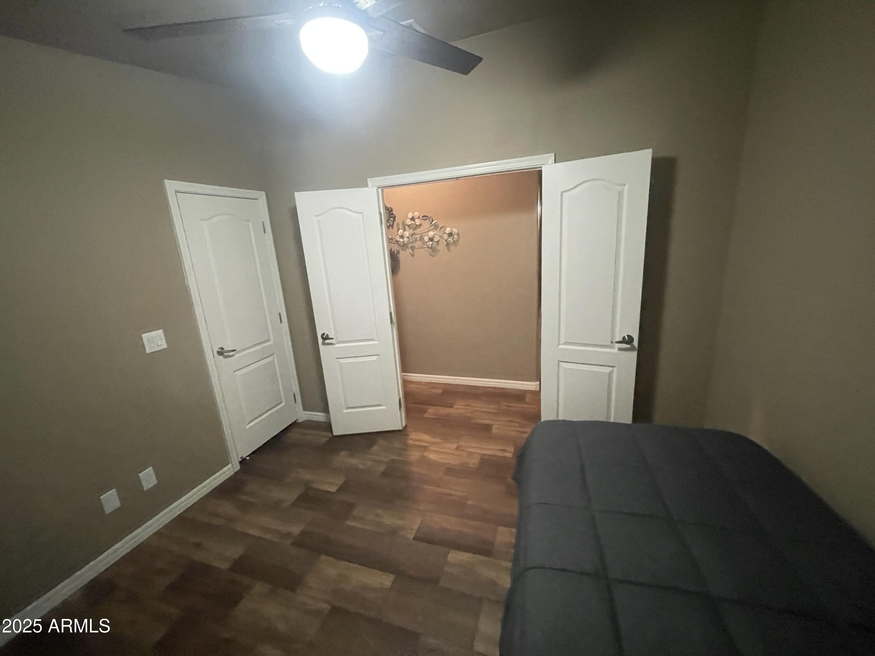 8865 East Baseline Road, Unit 555 Mesa, AZ 85209 - Photo 16 of 21 a view of a big room with closet and wooden door
