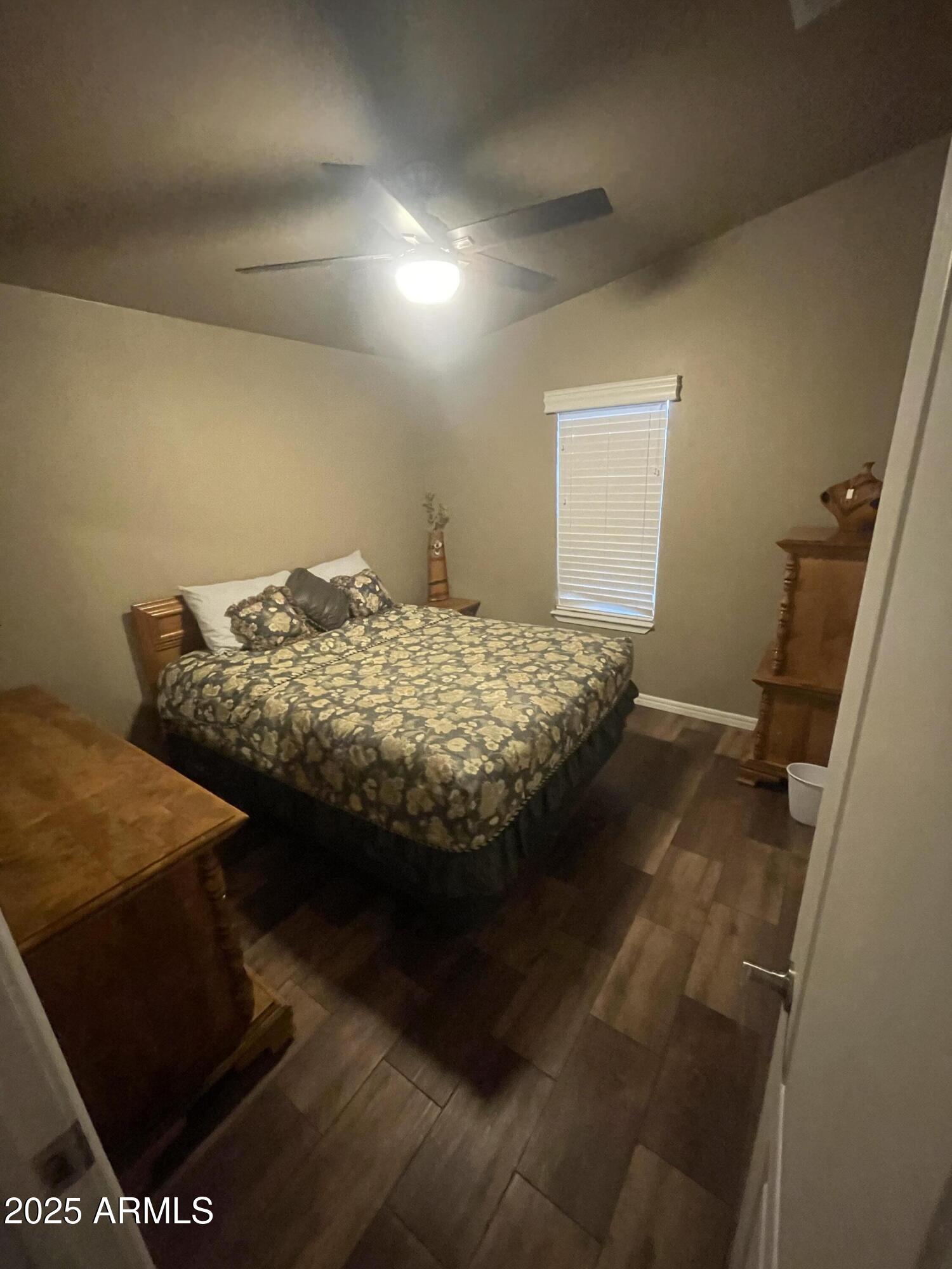 8865 East Baseline Road, Unit 555 Mesa, AZ 85209 - Photo 17 of 21 a bedroom with bed and window