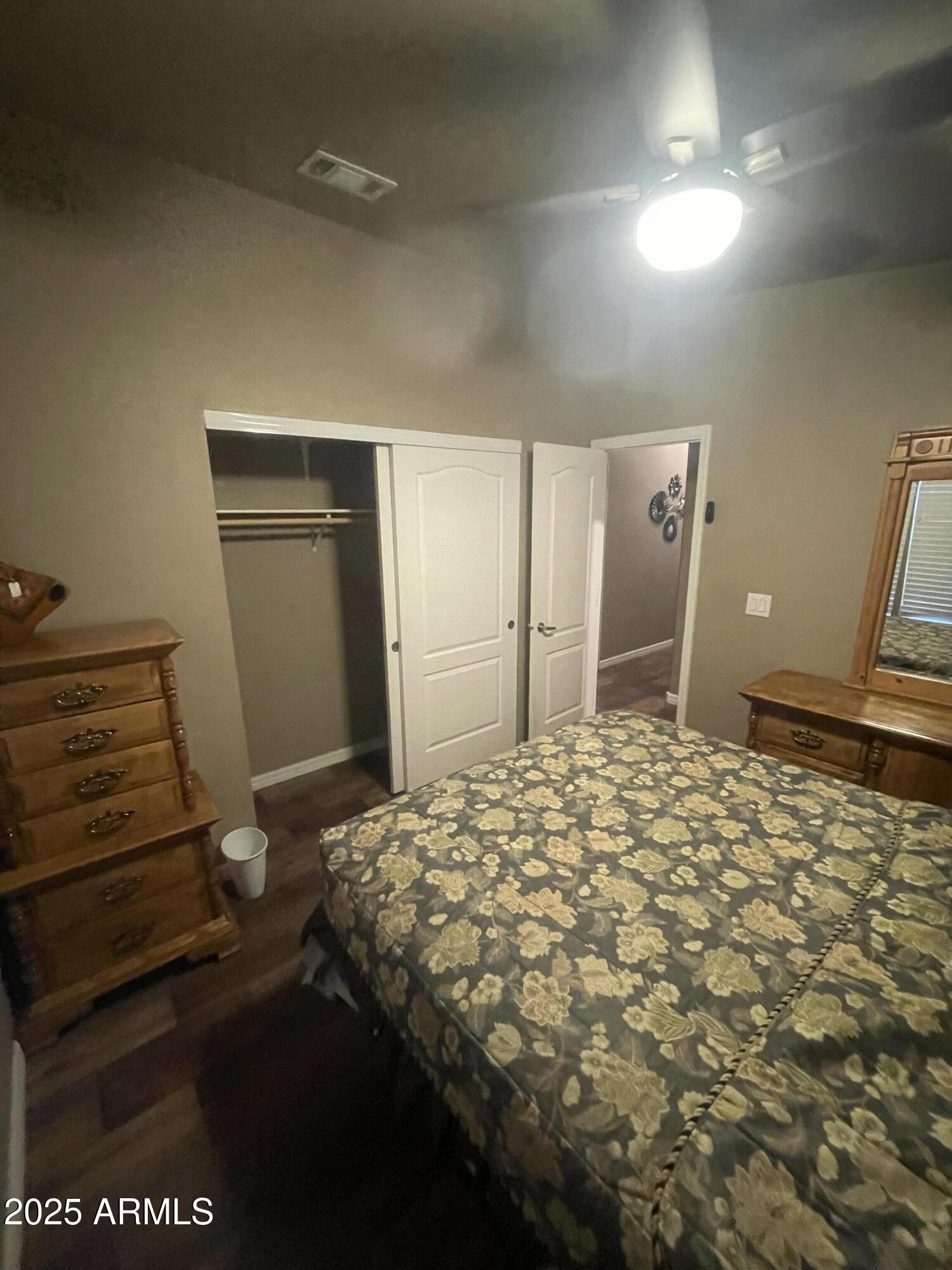 8865 East Baseline Road, Unit 555 Mesa, AZ 85209 - Photo 18 of 21 a bedroom with a bed and a dresser