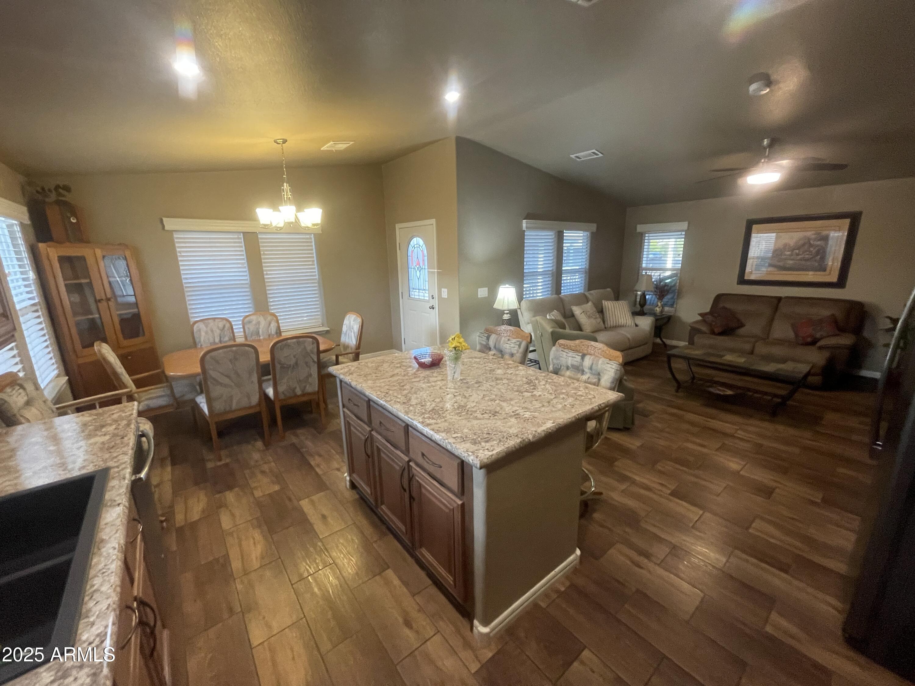 8865 East Baseline Road, Unit 555 Mesa, AZ 85209 - Photo 5 of 21 a living room with furniture and a flat screen tv