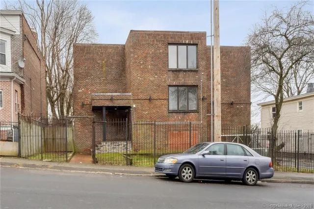 a car parked in front of a building