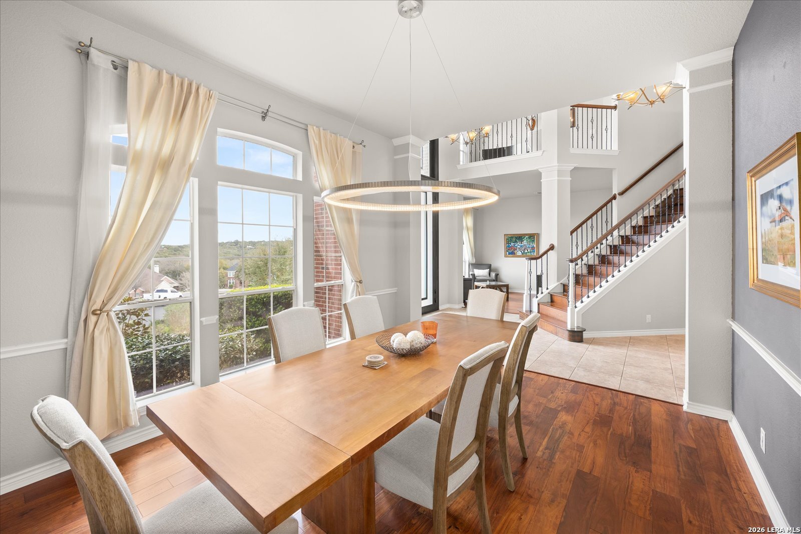 8718 Timberland Trail Fair Oaks Ranch, TX 78015 - Photo 11 of 50 a view of a dining room with furniture window and wooden floor