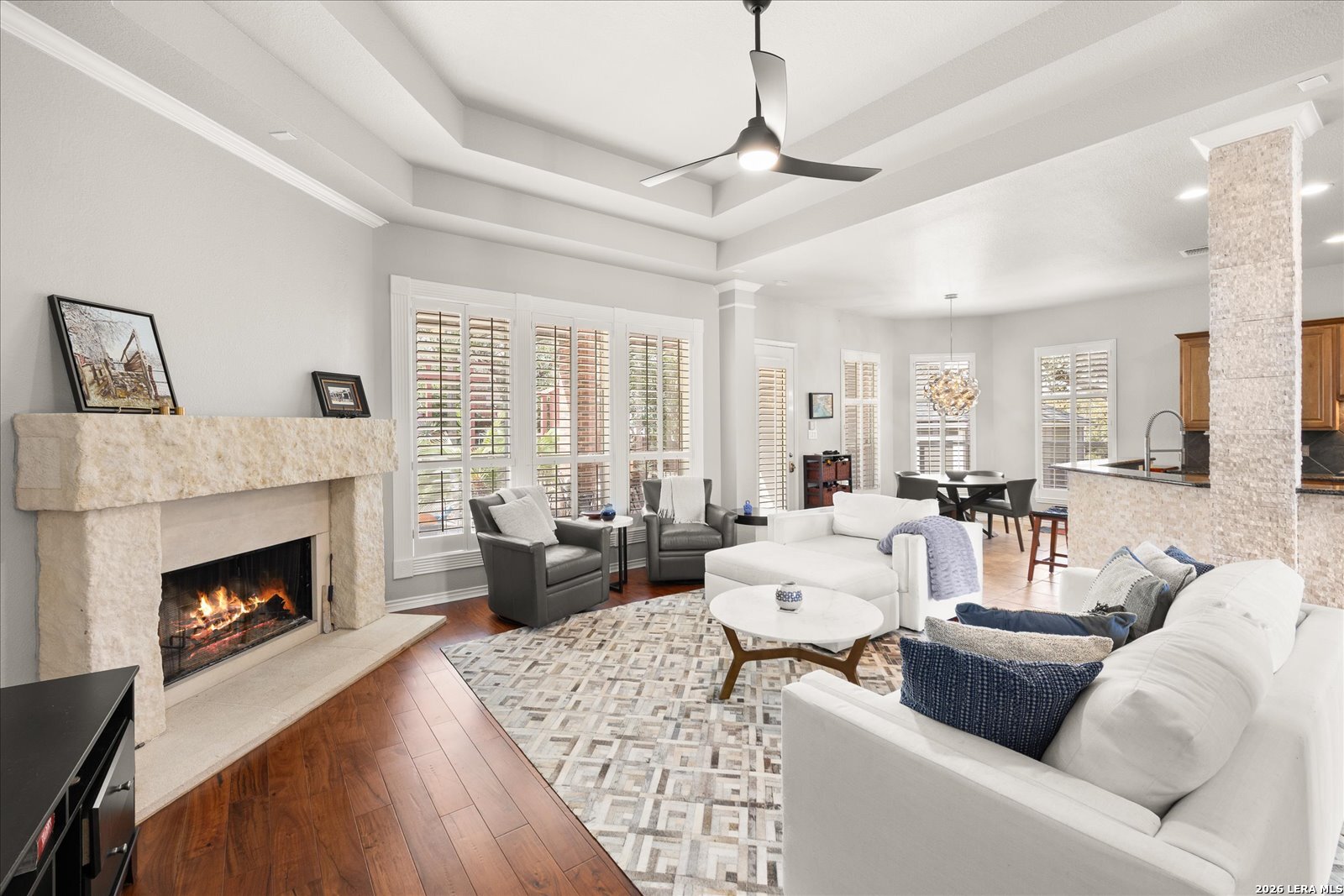 8718 Timberland Trail Fair Oaks Ranch, TX 78015 - Photo 14 of 50 a living room with furniture and a fireplace