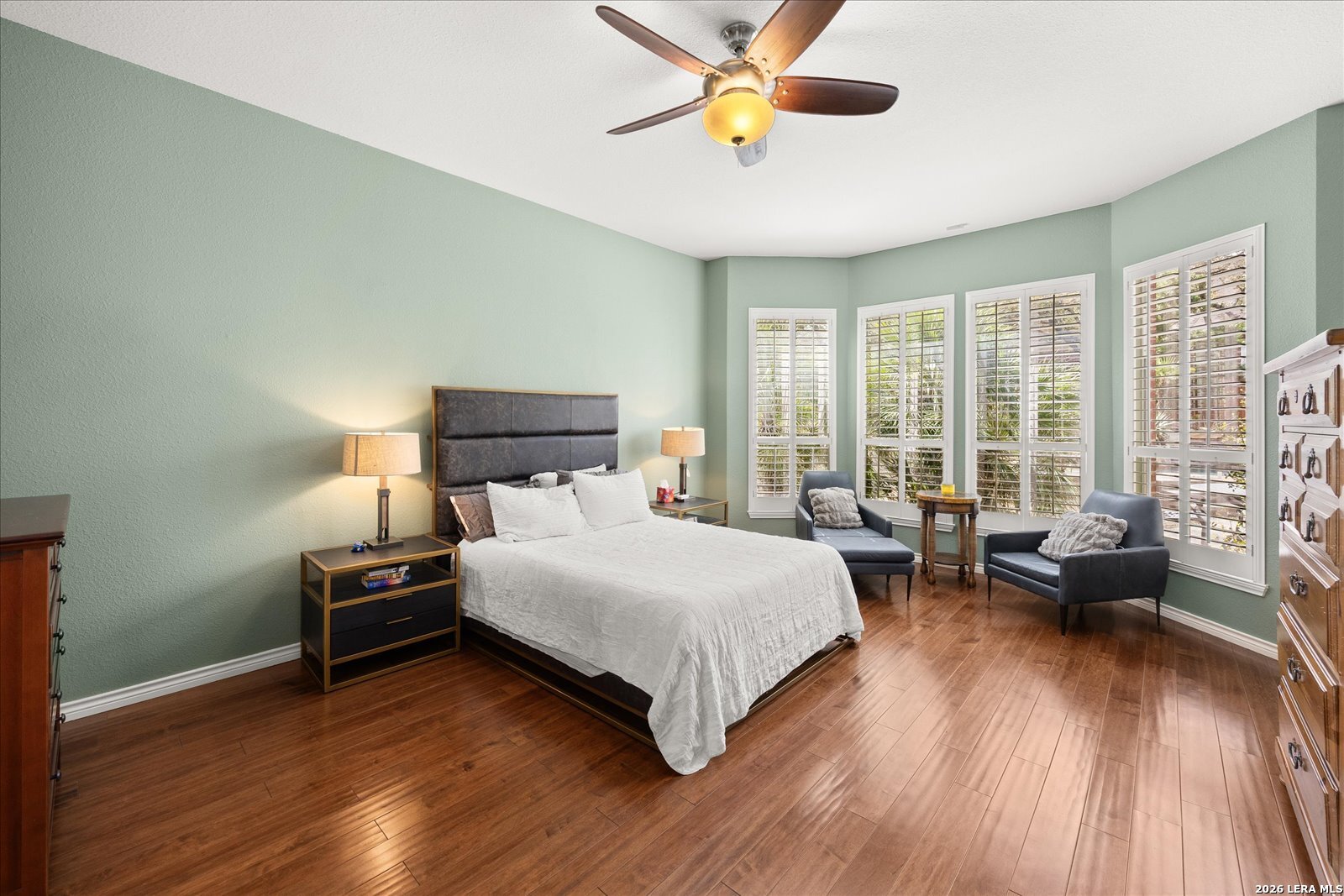 8718 Timberland Trail Fair Oaks Ranch, TX 78015 - Photo 22 of 50 a bedroom with a bed and wooden floor