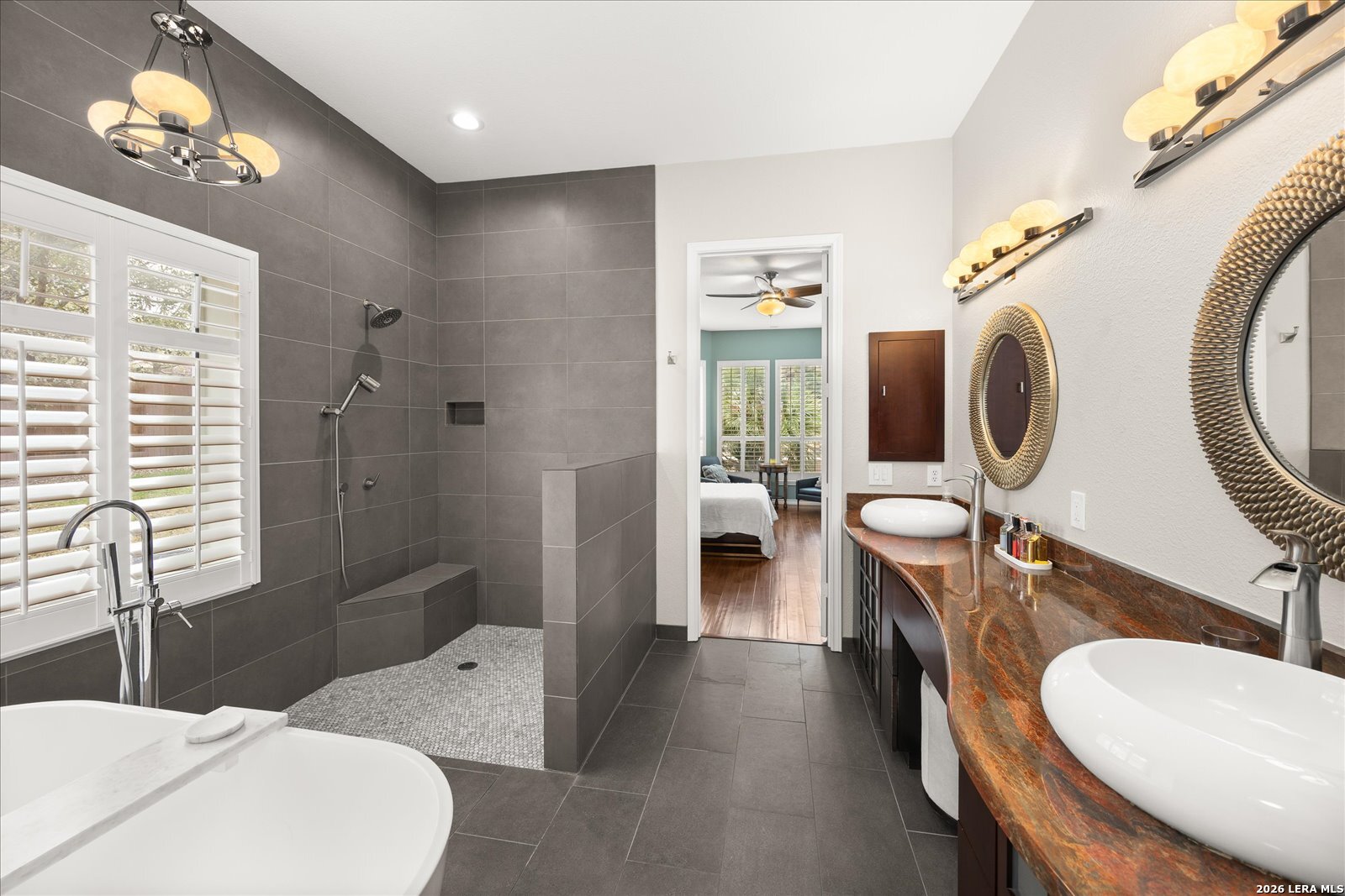 8718 Timberland Trail Fair Oaks Ranch, TX 78015 - Photo 24 of 50 a bathroom with a granite countertop sink mirror vanity and toilet