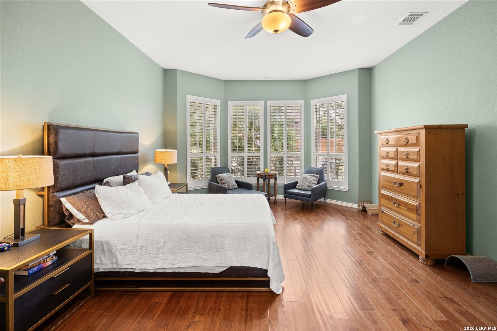 8718 Timberland Trail Fair Oaks Ranch, TX 78015 - Photo 28 of 50 a bedroom with a bed and wooden floor