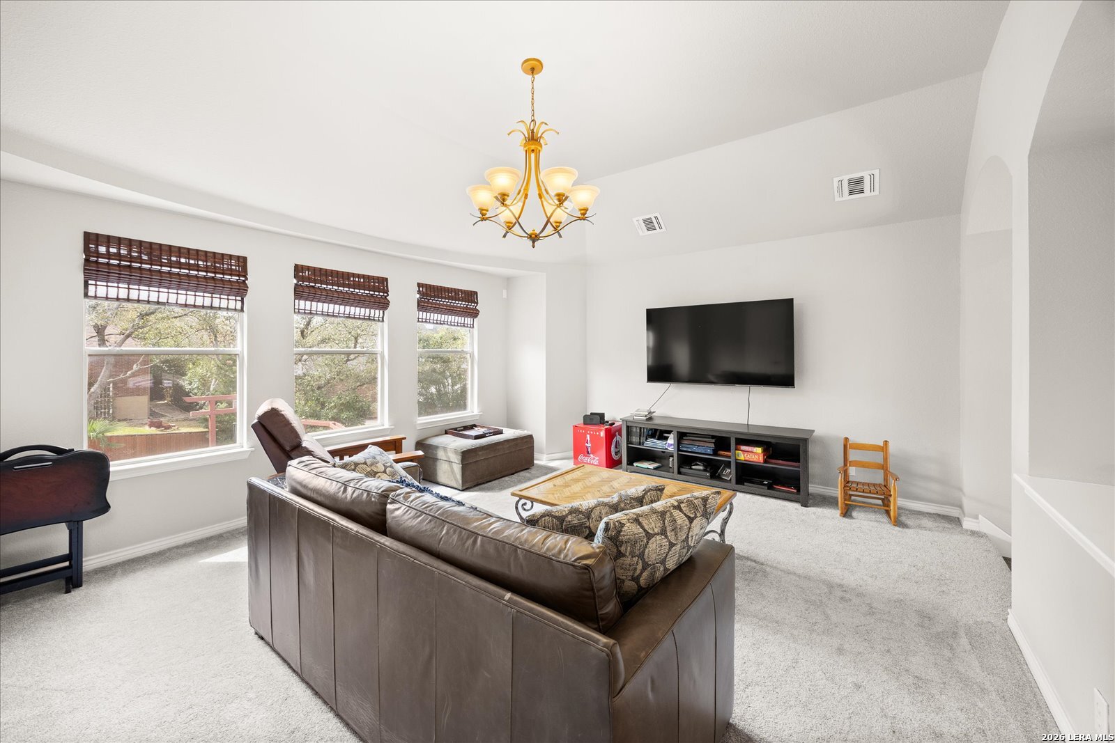 8718 Timberland Trail Fair Oaks Ranch, TX 78015 - Photo 30 of 50 a living room with furniture and a flat screen tv