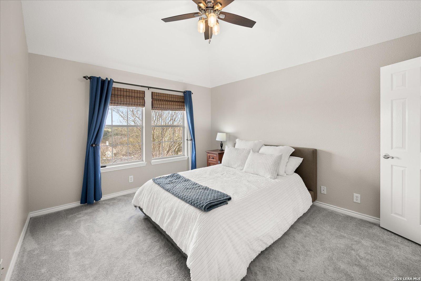 8718 Timberland Trail Fair Oaks Ranch, TX 78015 - Photo 33 of 50 a bedroom with a bed and window