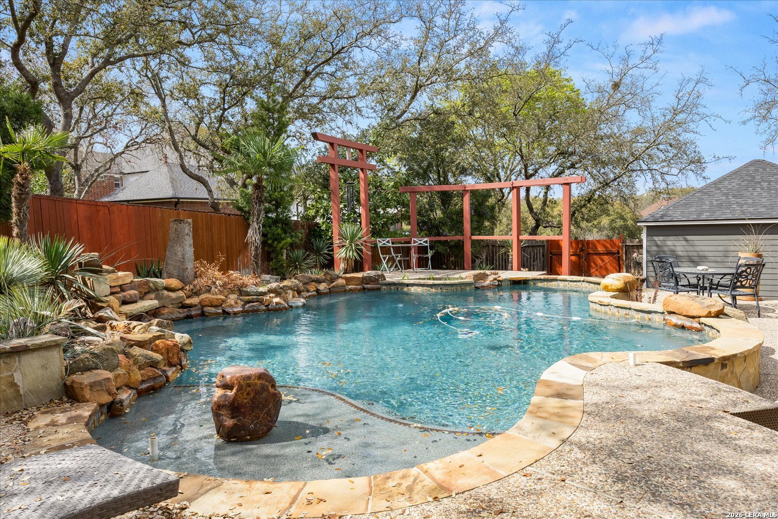 8718 Timberland Trail Fair Oaks Ranch, TX 78015 - Photo 40 of 50 a view of a backyard with swimming pool