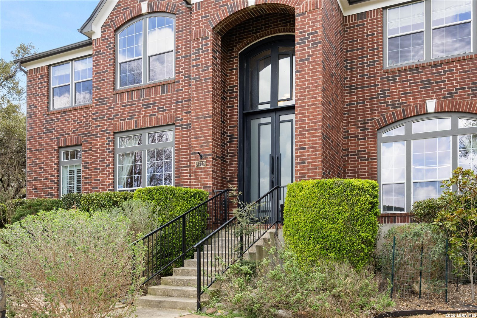 8718 Timberland Trail Fair Oaks Ranch, TX 78015 - Photo 4 of 50 a brick building with a large windows