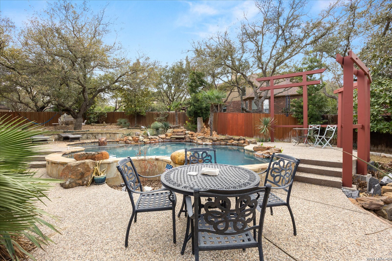 8718 Timberland Trail Fair Oaks Ranch, TX 78015 - Photo 41 of 50 a view of a patio with a table and chairs