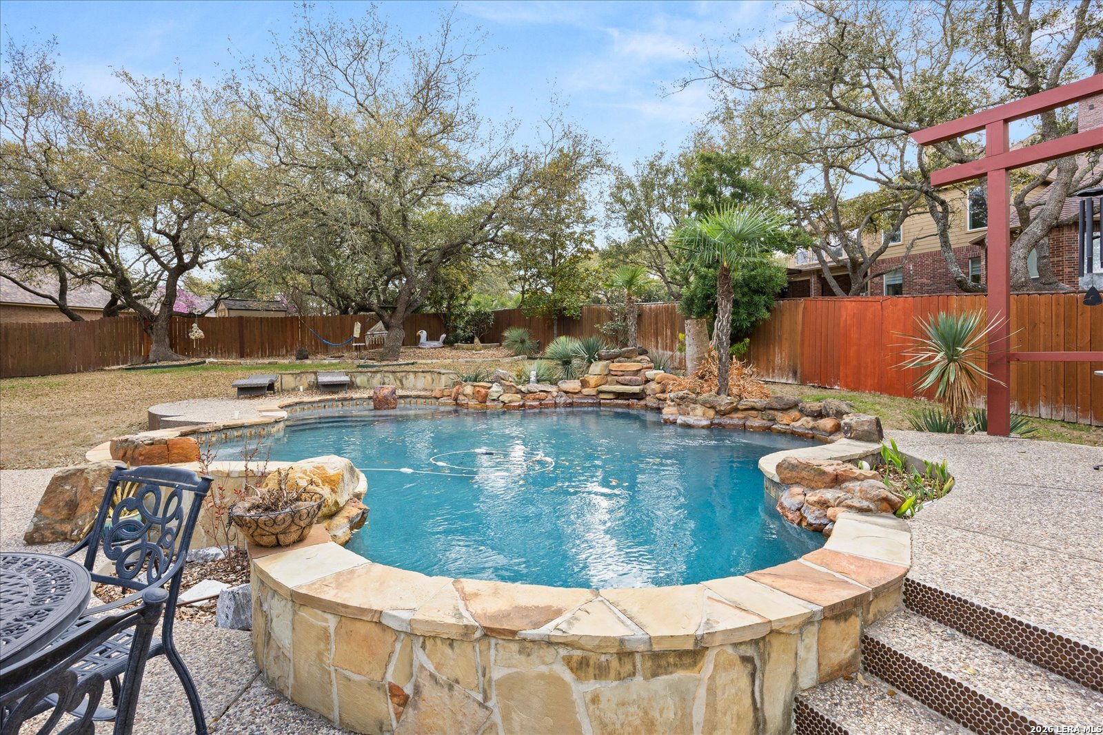 8718 Timberland Trail Fair Oaks Ranch, TX 78015 - Photo 44 of 50 a view of a swimming pool with chairs