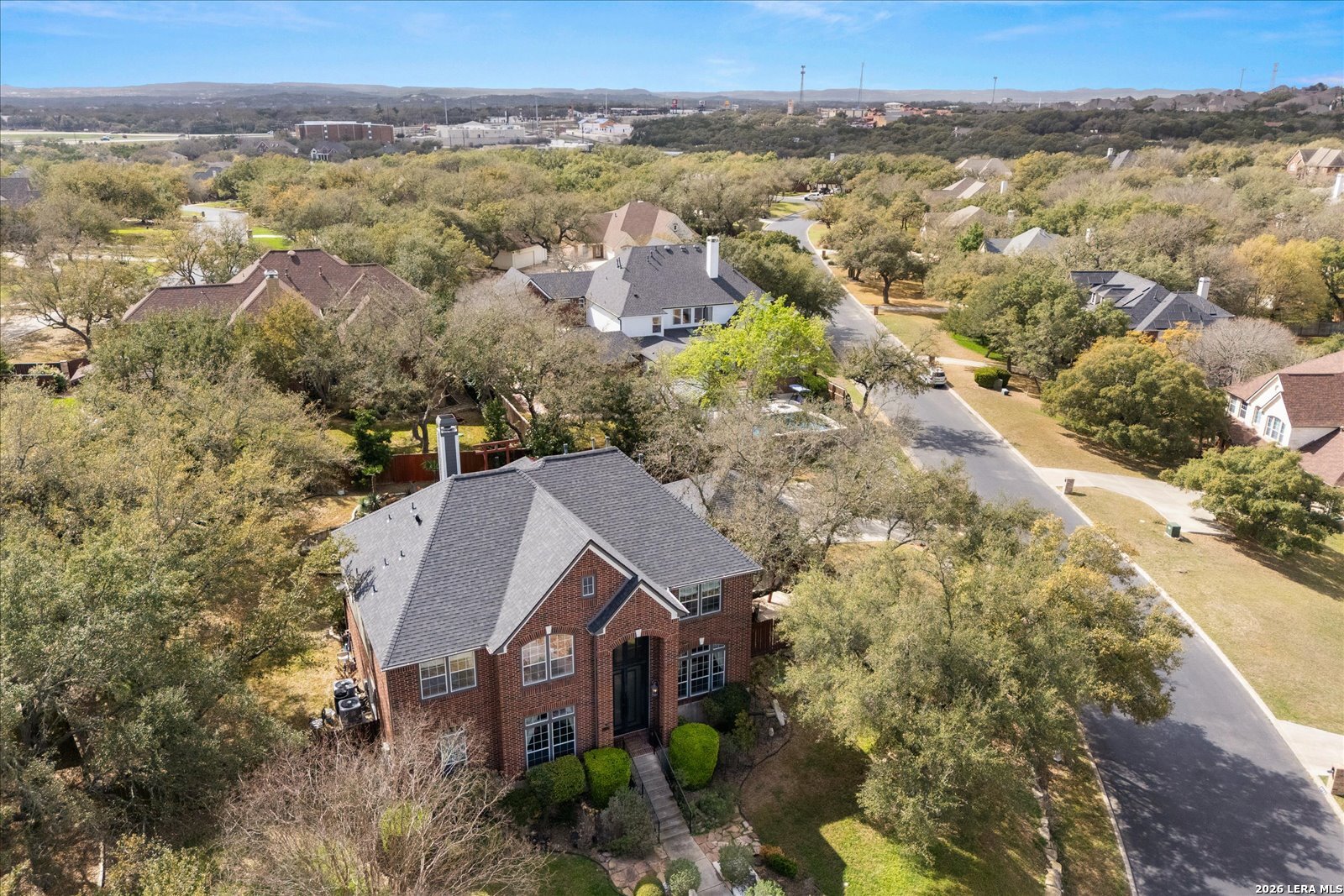 8718 Timberland Trail Fair Oaks Ranch, TX 78015 - Photo 47 of 50 an aerial view of a house with a yard