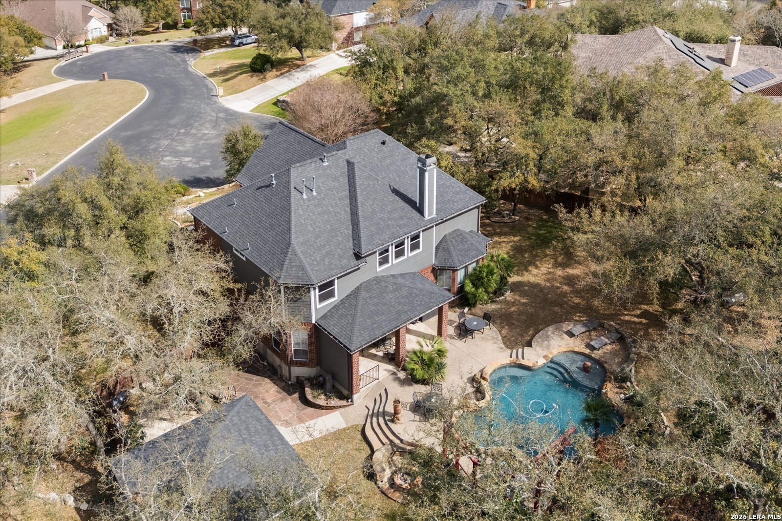 8718 Timberland Trail Fair Oaks Ranch, TX 78015 - Photo 49 of 50 an aerial view of a house with a yard
