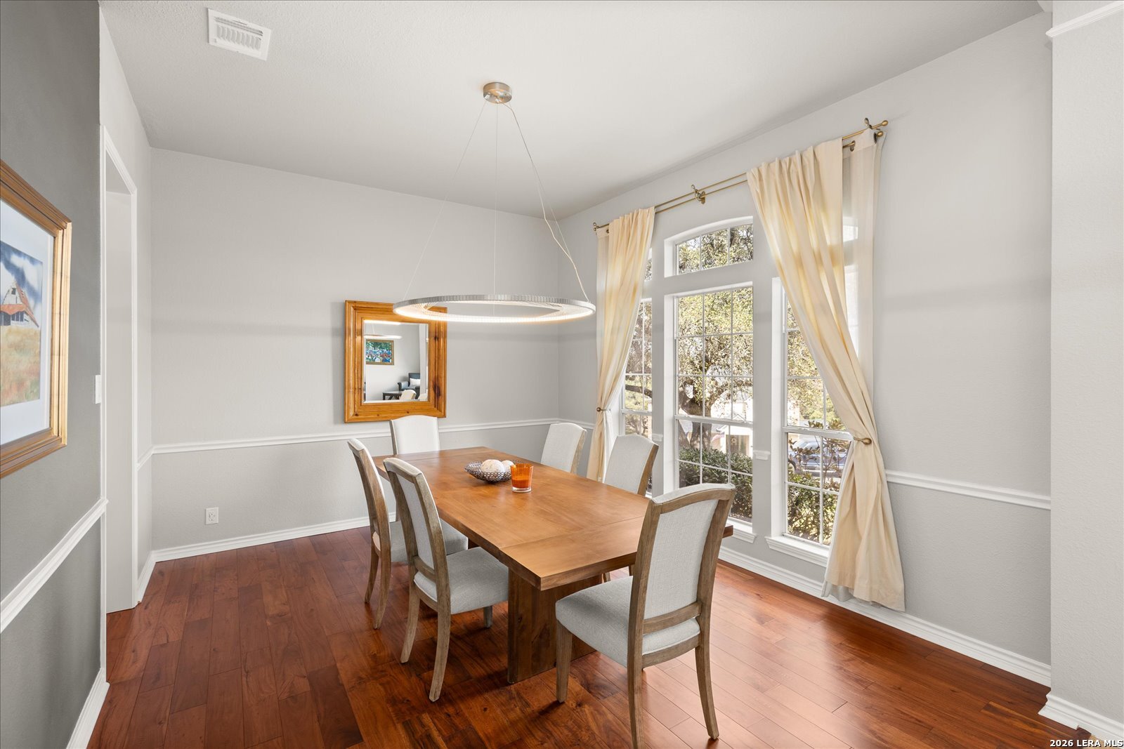 8718 Timberland Trail Fair Oaks Ranch, TX 78015 - Photo 9 of 50 a view of a dining room with furniture and wooden floor
