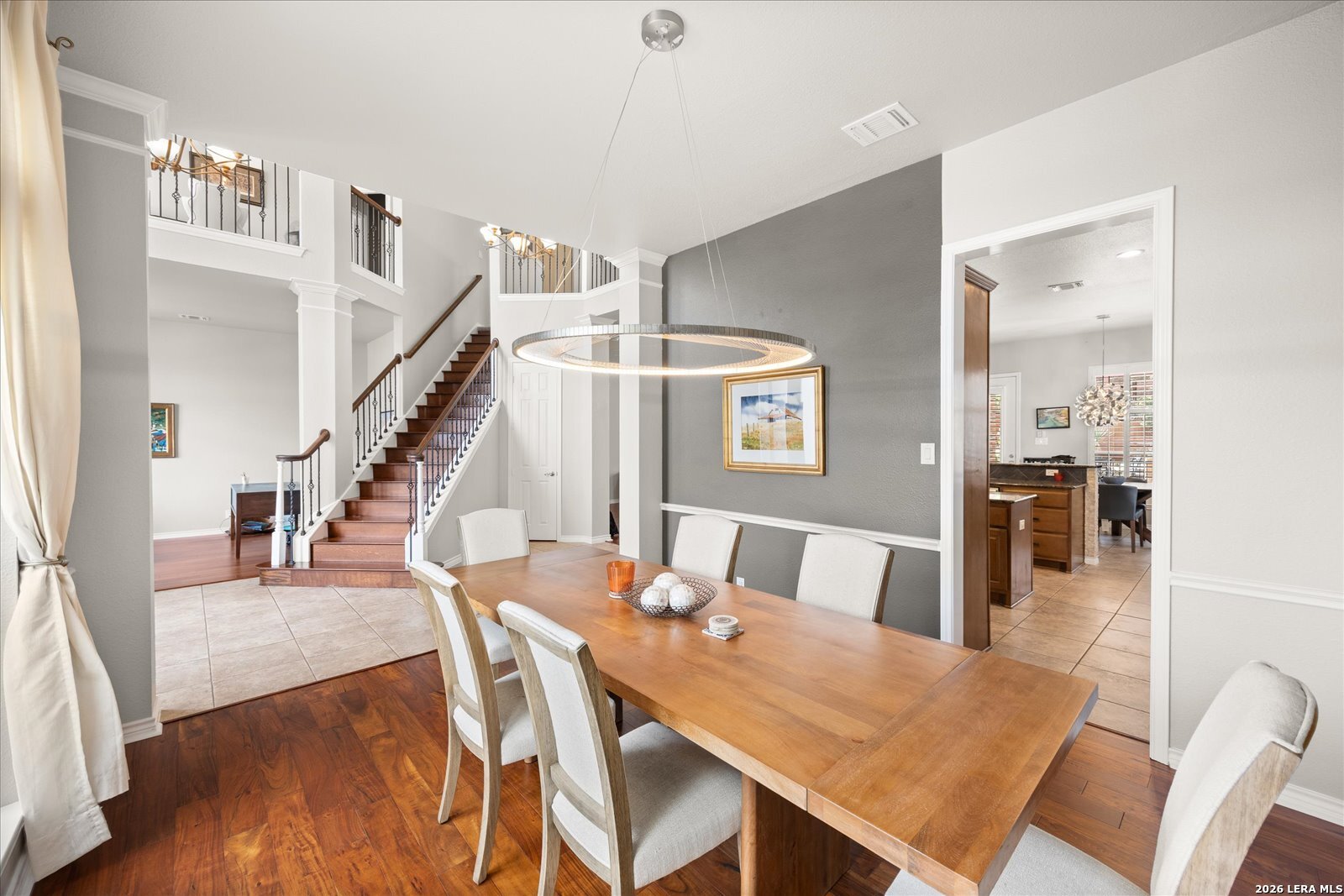 8718 Timberland Trail Fair Oaks Ranch, TX 78015 - Photo 10 of 50 a view of a dining room with furniture and wooden floor