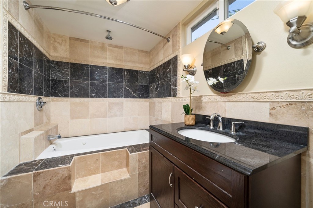 760 West Aster Street Upland, CA 91786 - Photo 13 of 40 a bathroom with a sink and a mirror