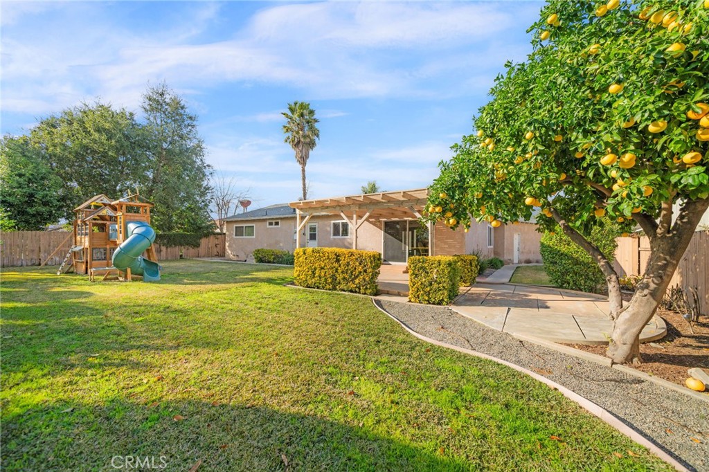 760 West Aster Street Upland, CA 91786 - Photo 22 of 40 a front view of a house with a yard