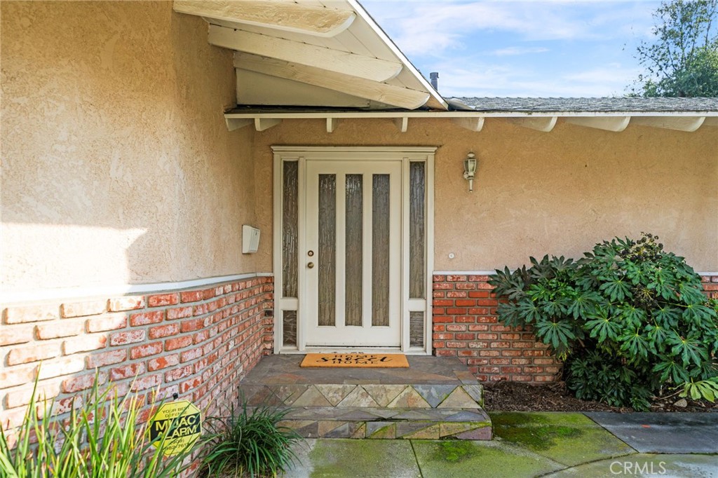 760 West Aster Street Upland, CA 91786 - Photo 40 of 40 a front view of a house with a yard
