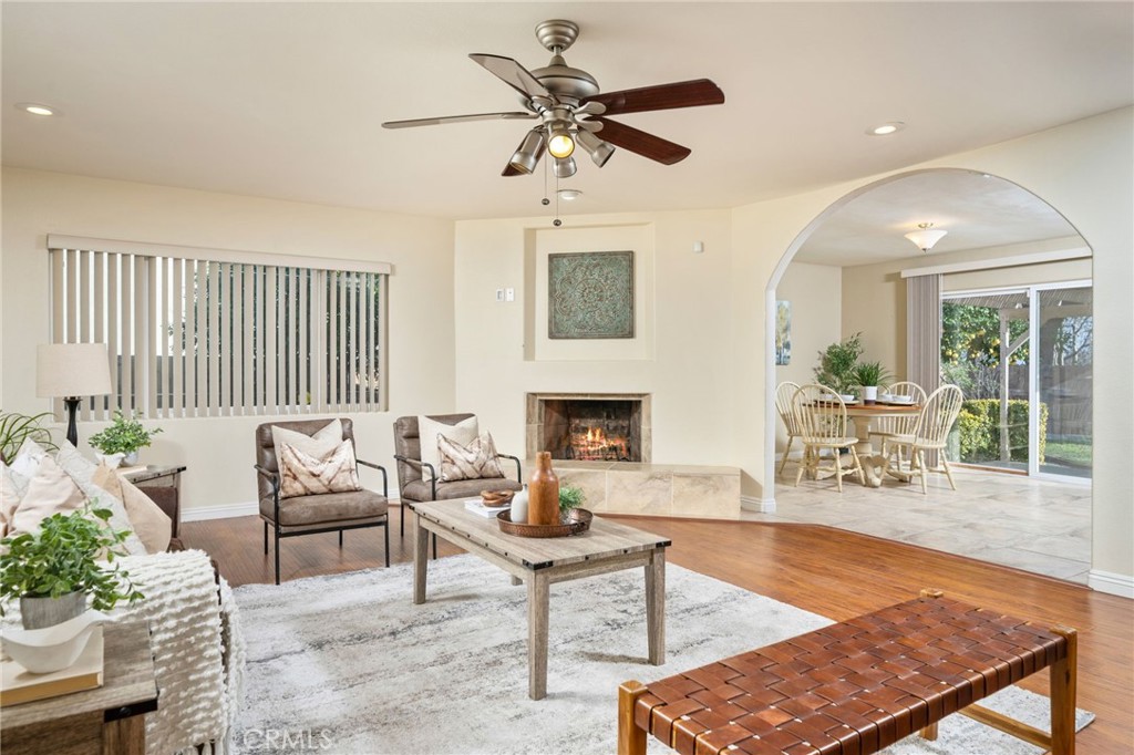 760 West Aster Street Upland, CA 91786 - Photo 5 of 40 a living room with furniture a fireplace and a chandelier