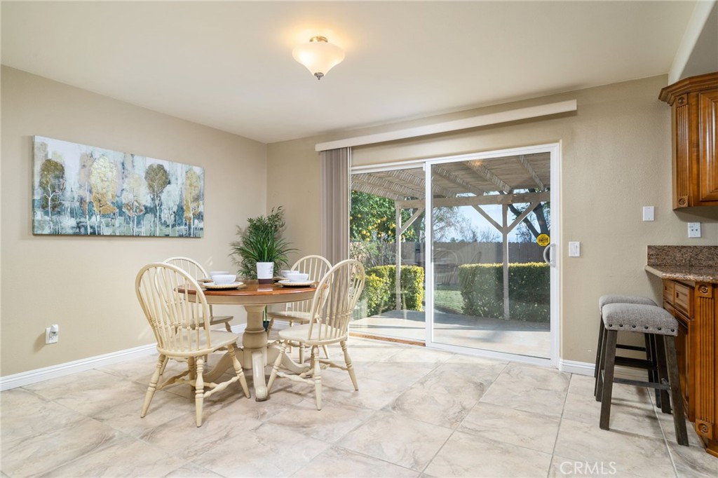 760 West Aster Street Upland, CA 91786 - Photo 10 of 40 a dining room with furniture and large windows