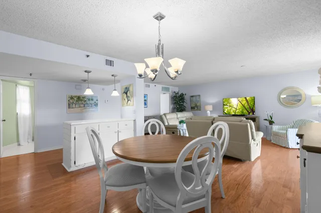 a view of a room with furniture and windows