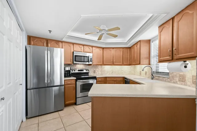 a view of a workspace with furniture and wooden floor